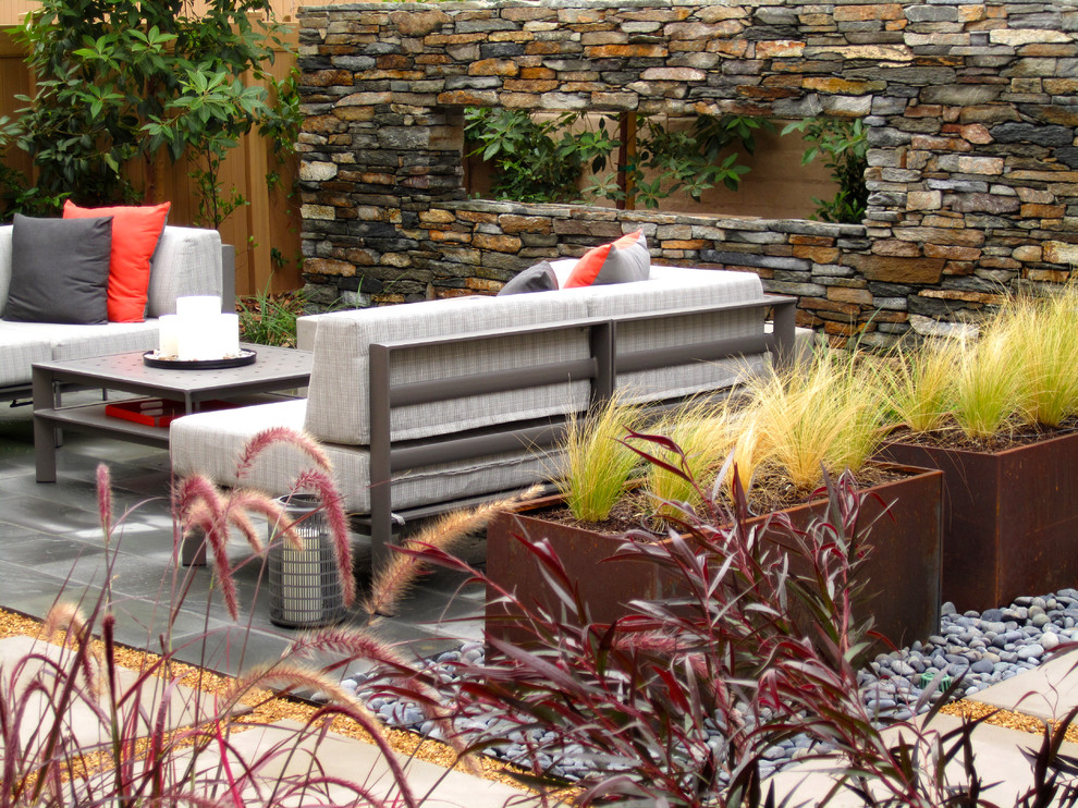 Medium sized contemporary back full sun garden in Los Angeles with an outdoor sport court and natural stone paving.
