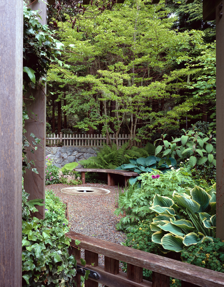Design ideas for a nautical back fully shaded garden seating for summer in Seattle with a water feature and gravel.