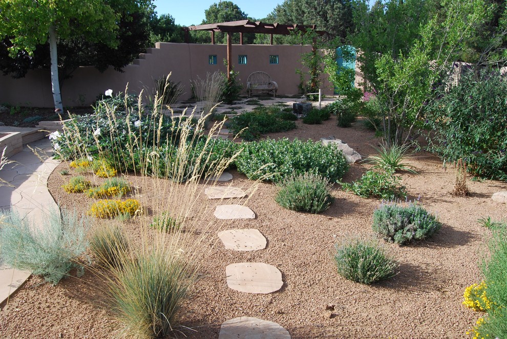Inspiration for a mid-sized asian partial sun backyard stone landscaping in Albuquerque for summer.