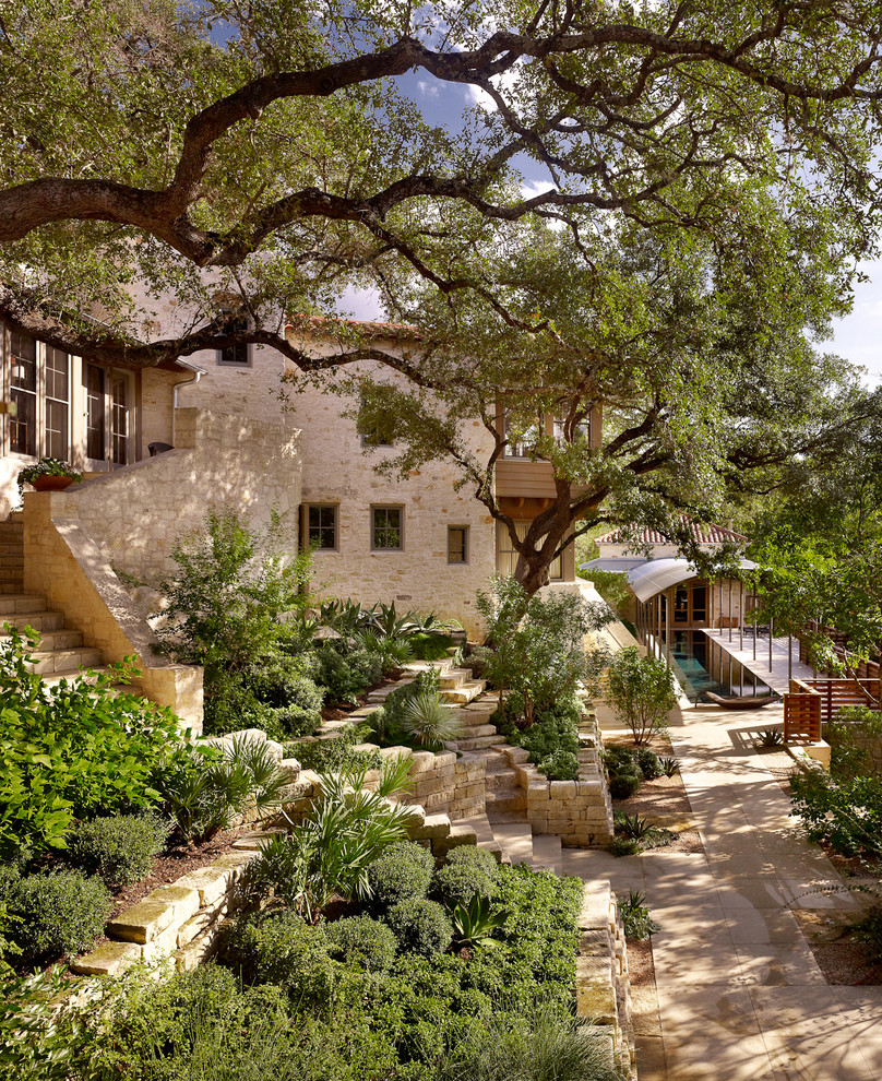 This is an example of a mediterranean courtyard garden in Austin.