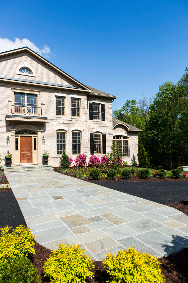 Inspiration for a huge rustic full sun front yard stone landscaping in DC Metro.