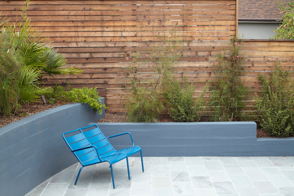 Design ideas for a mid-sized contemporary full sun backyard stone landscaping in San Francisco.