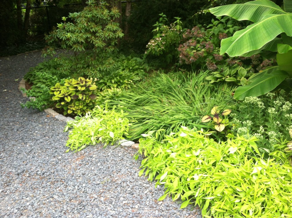 Photo of a mid-sized traditional front yard gravel garden path in Providence.
