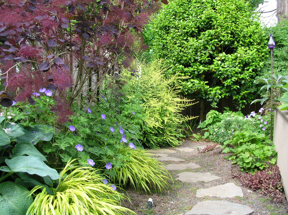 This is an example of a small craftsman partial sun backyard stone garden path in Portland for summer.