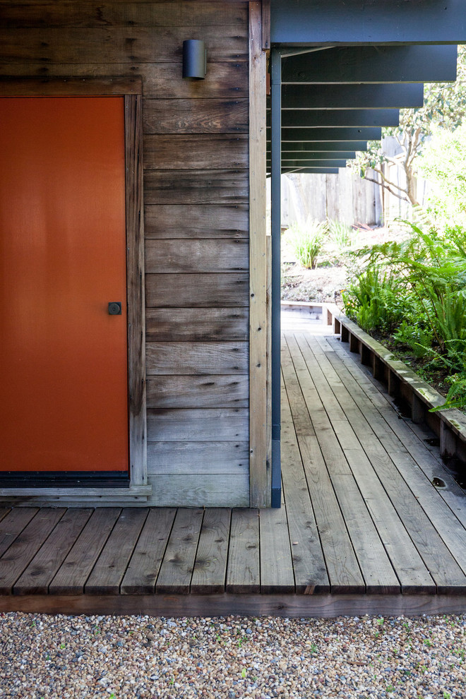 This is an example of a medium sized midcentury side garden in San Francisco with decking.