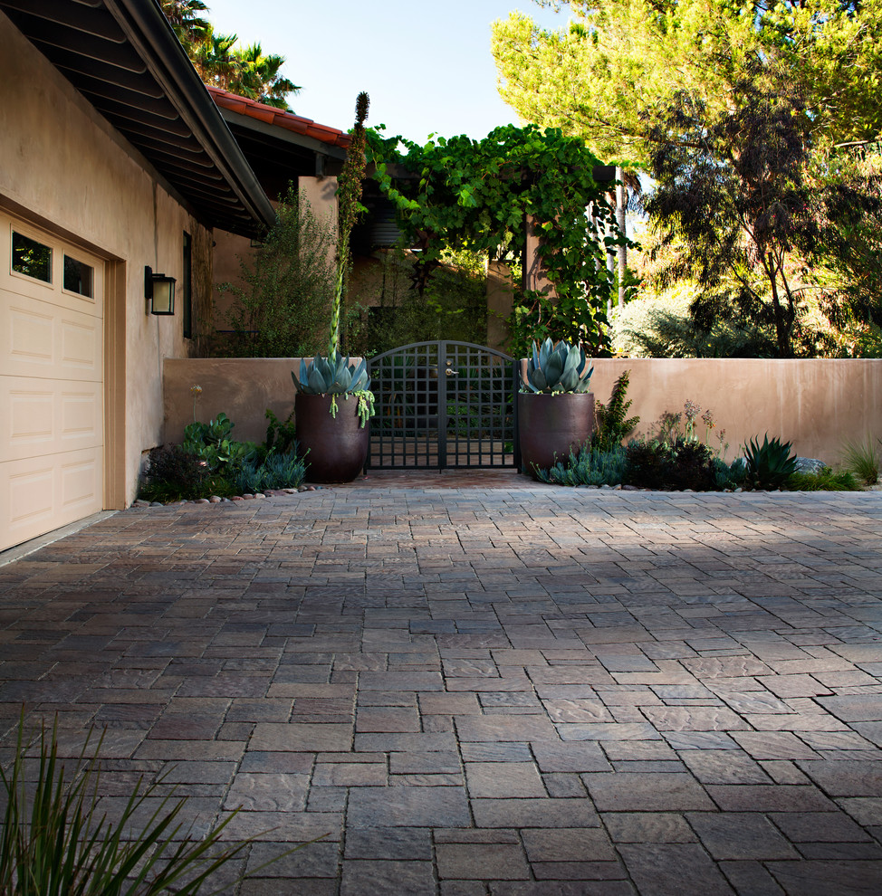 Inspiration for a large traditional front driveway fully shaded garden in San Diego with a potted garden and concrete paving.