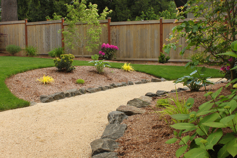 Medium sized contemporary back garden in Portland with decomposed granite.