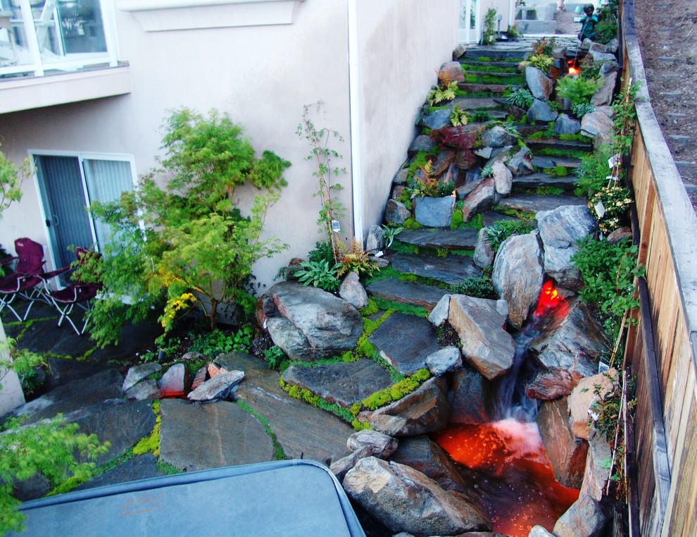 Photo of a small asian partial sun backyard stone landscaping in San Luis Obispo for summer.