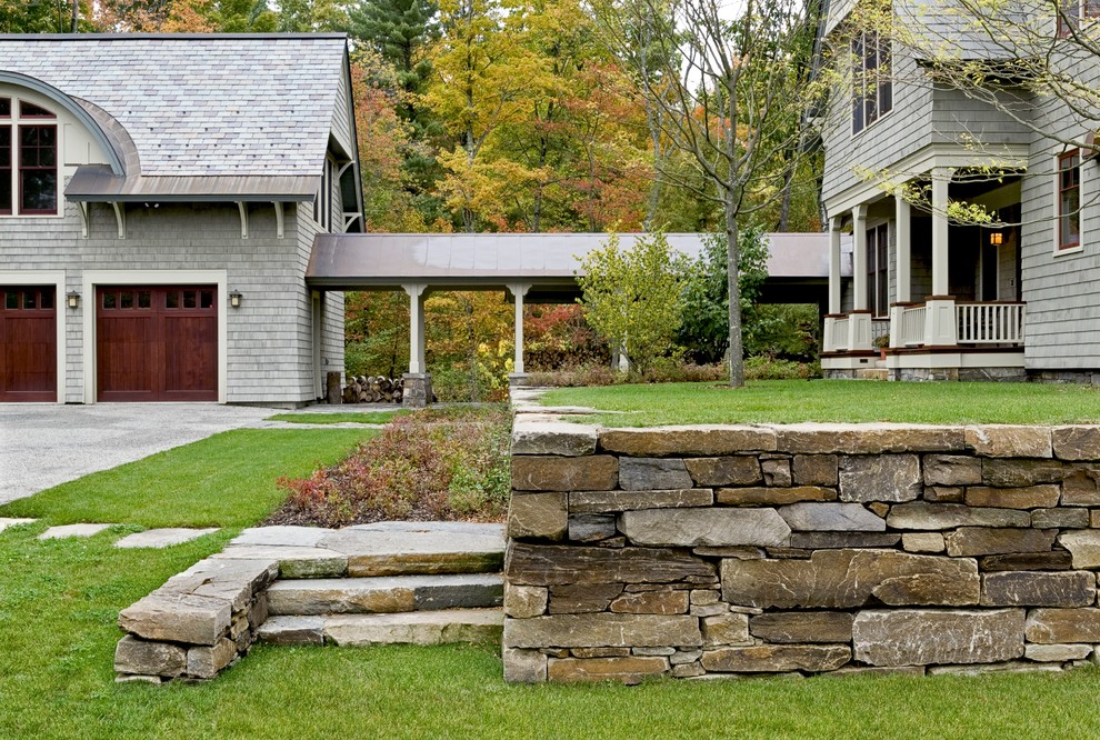 Photo of a victorian side yard stone landscaping in Burlington.