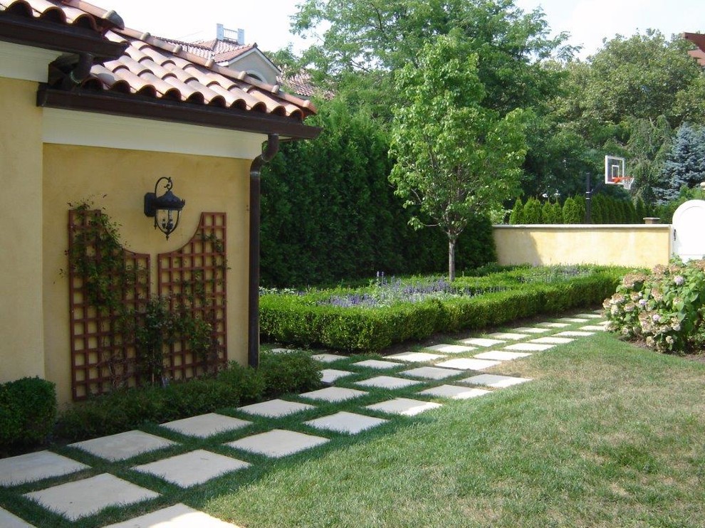 This is an example of a large contemporary backyard concrete paver landscaping in New York.