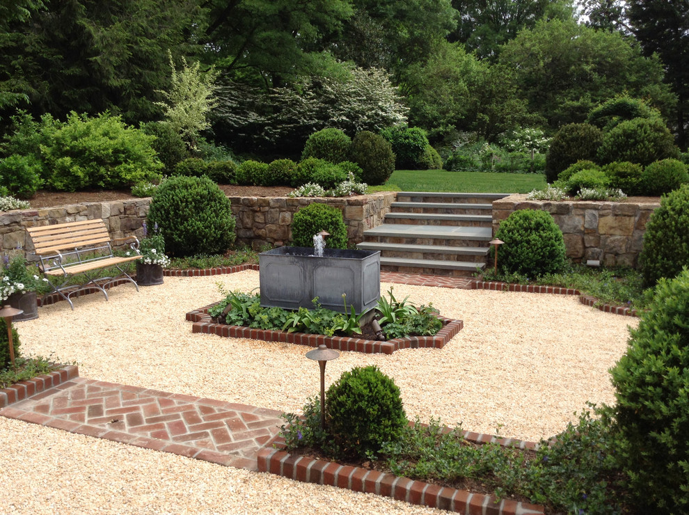 Design ideas for a large traditional full sun courtyard gravel landscaping in DC Metro.