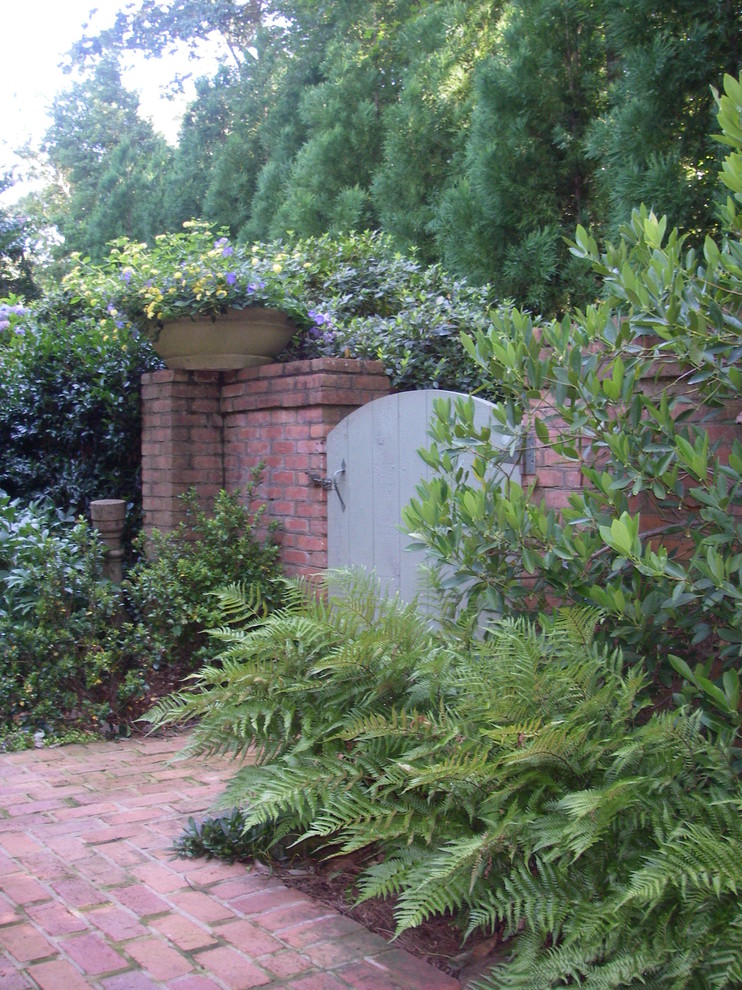 Design ideas for a small traditional backyard brick landscaping in Atlanta.