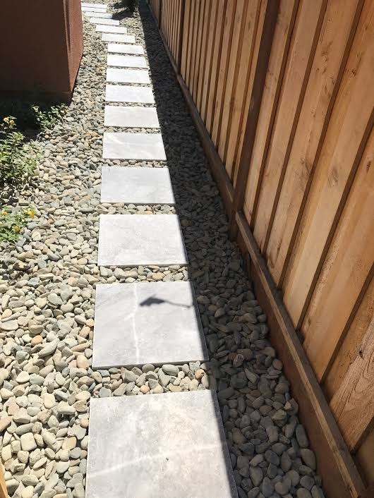 Photo of a large traditional partial sun side yard concrete paver garden path in San Francisco.