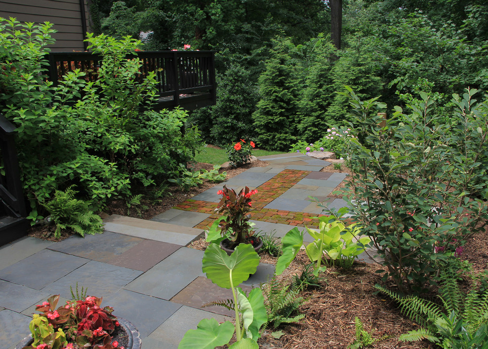 Photo of a mid-sized contemporary shade side yard stone garden path in DC Metro for winter.