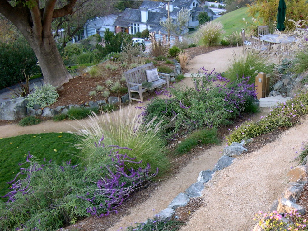 Inspiration for a large transitional partial sun and drought-tolerant backyard gravel retaining wall landscape in San Francisco.