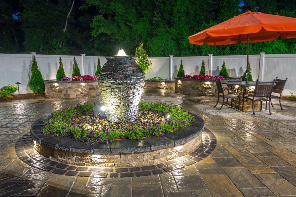 Design ideas for a large traditional full sun backyard concrete paver water fountain landscape in Orange County.