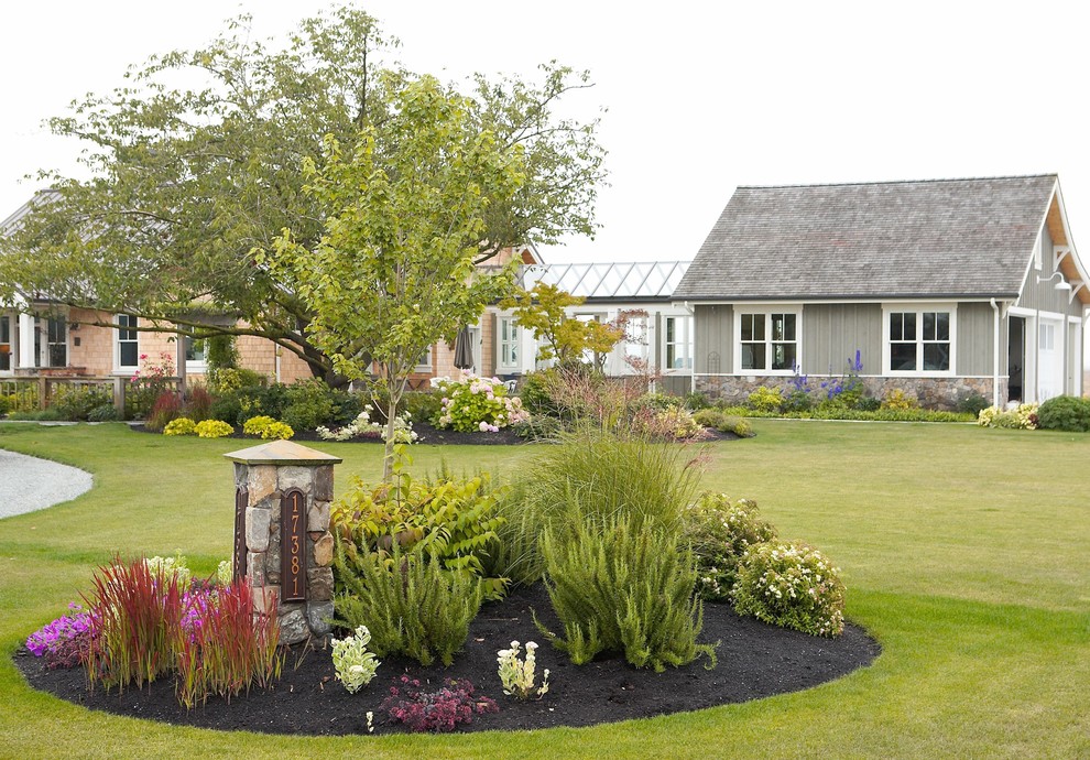 Photo of a large farmhouse full sun front yard formal garden in Seattle for summer.