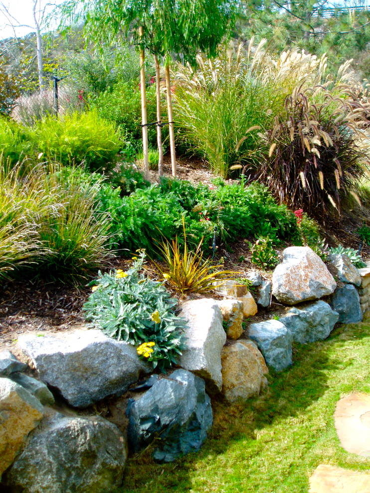 This is an example of a craftsman full sun backyard landscaping in San Diego.