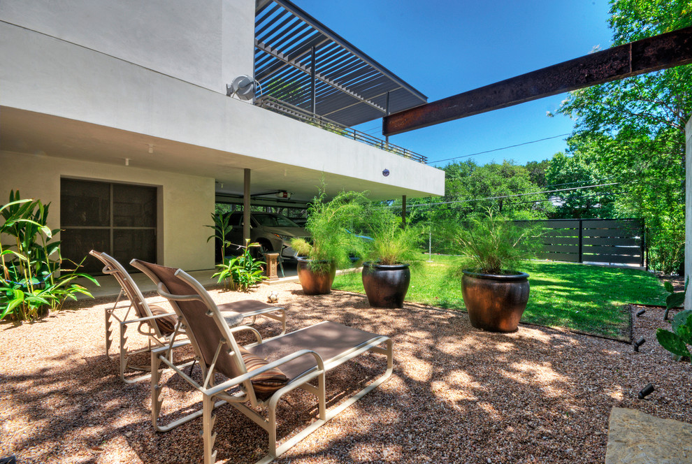Design ideas for a large contemporary front patio in Austin.