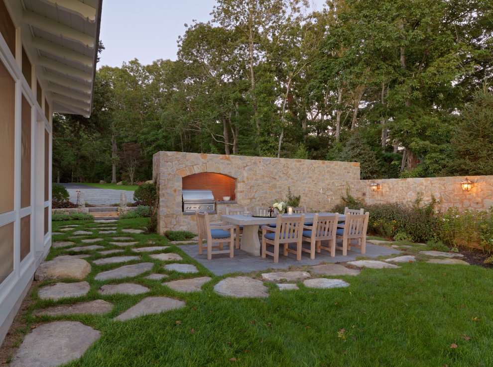 Photo of a large contemporary side fully shaded garden in Boston with natural stone paving.