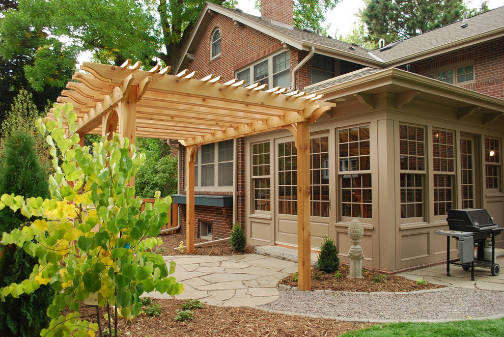 Design ideas for a traditional landscaping in Minneapolis with a pergola.
