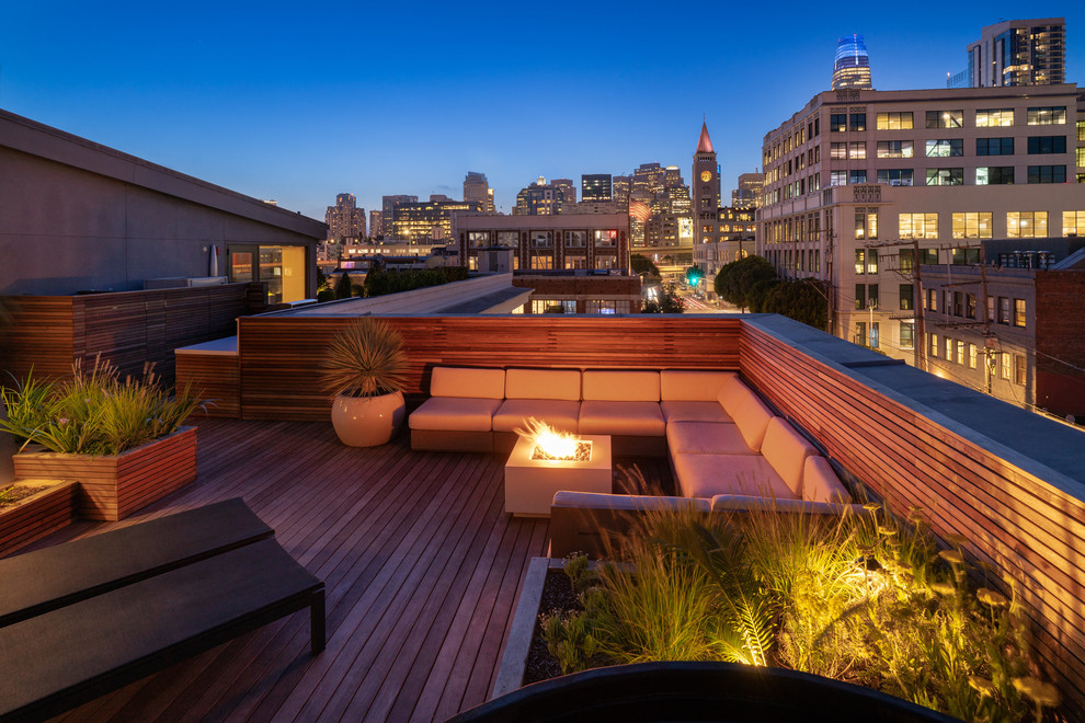 This is an example of a small modern roof terrace in San Francisco with a fire feature.