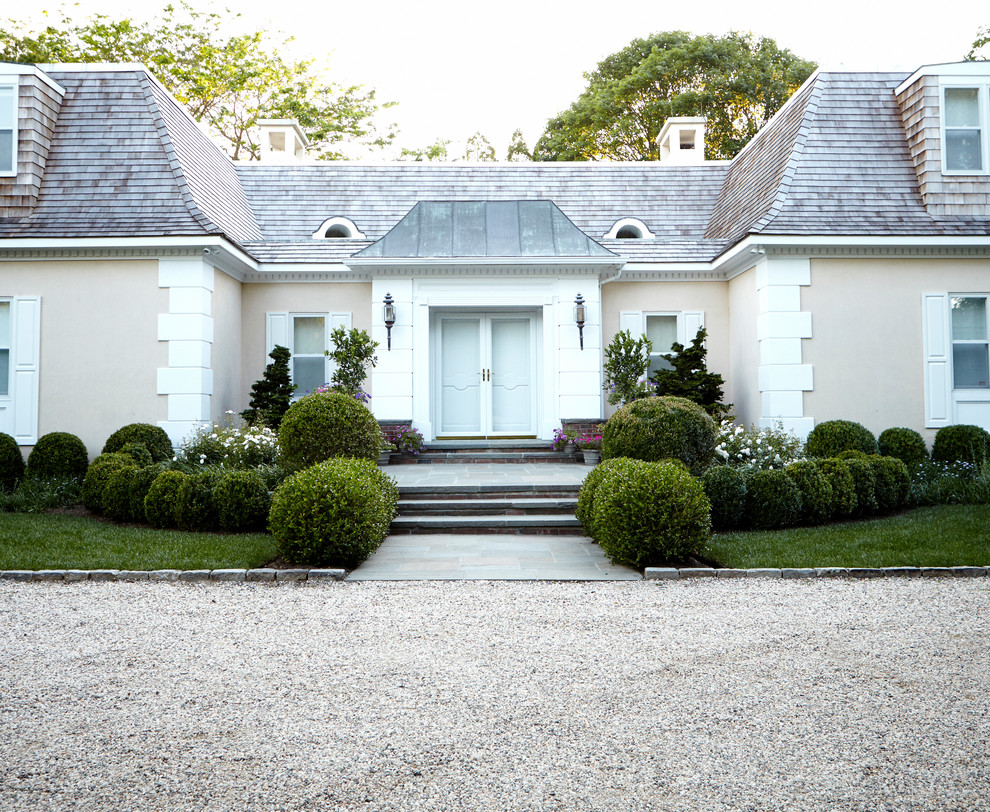 Inspiration for a large contemporary full sun front yard gravel formal garden in New York.