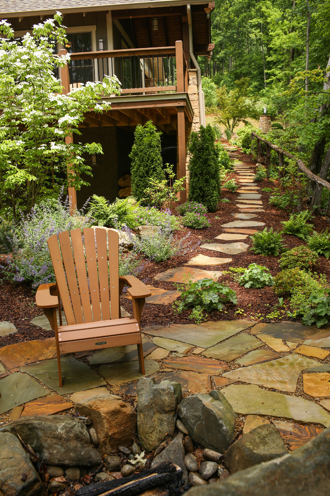 Photo of a medium sized rustic back fully shaded garden for summer in Charlotte with a garden path and natural stone paving.