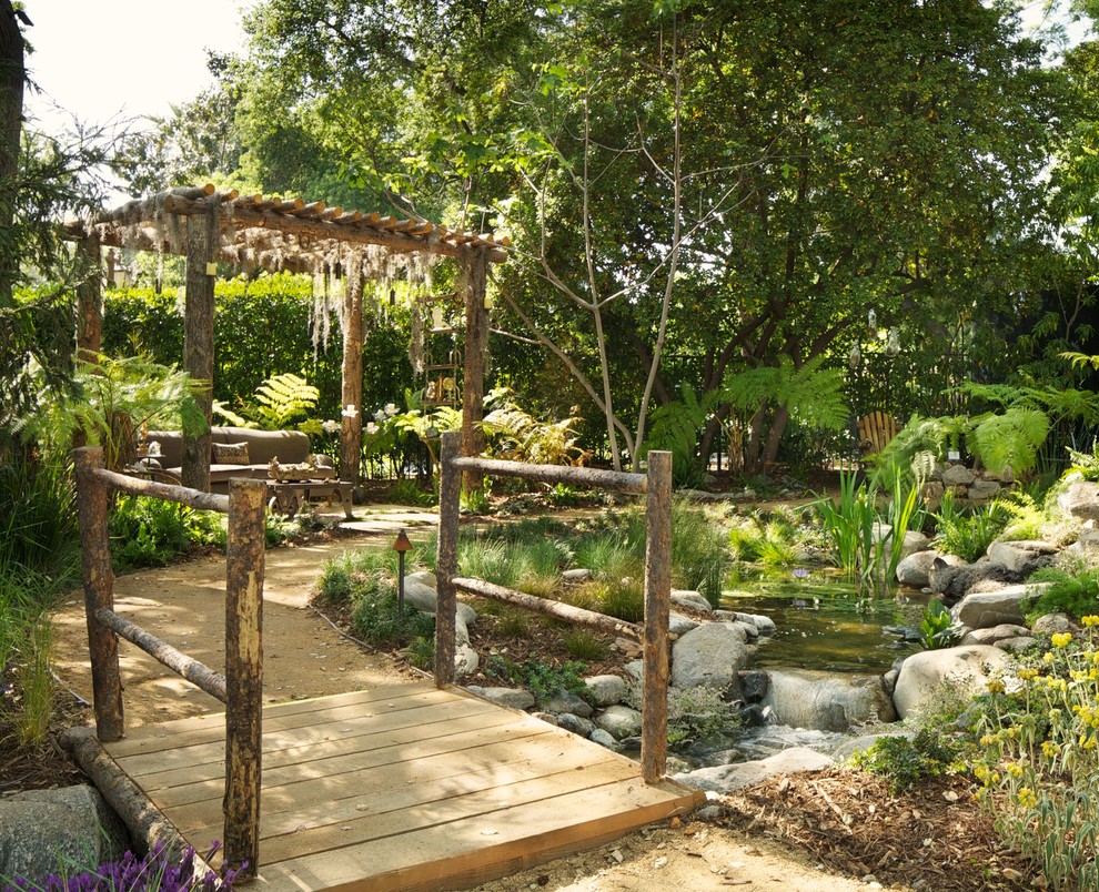 Eclectic garden in Los Angeles with a fire feature.