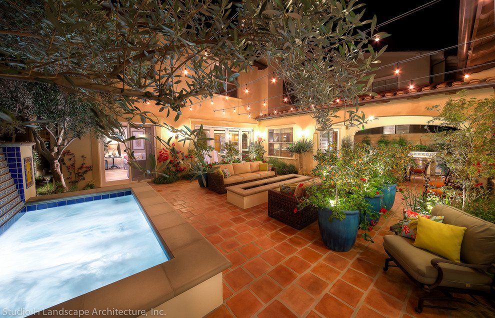 Inspiration for a mid-sized mediterranean partial sun courtyard landscaping in Orange County.