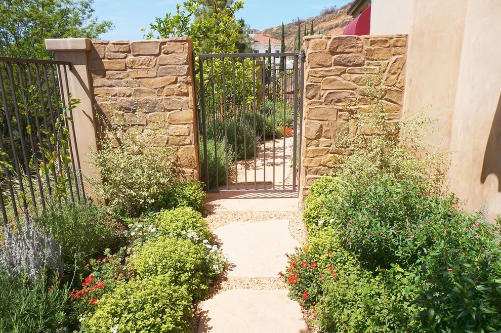 Photo of a large mediterranean courtyard formal garden in Orange County.