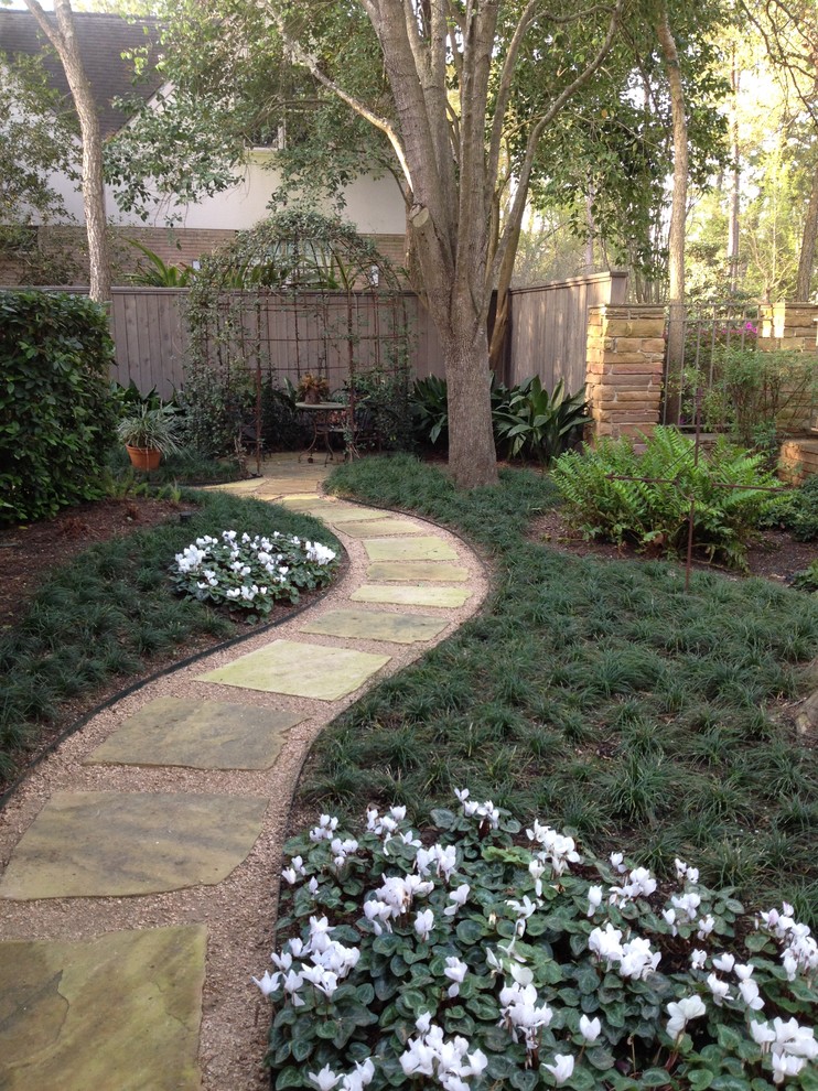 Photo of a traditional courtyard stone garden path in Houston for spring.