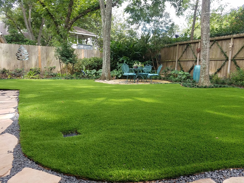 Design ideas for a large traditional partial sun backyard formal garden in Houston.