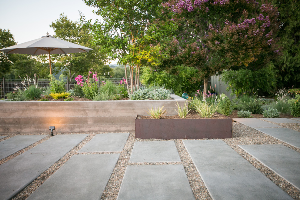 Design ideas for a large contemporary backyard gravel landscaping in San Francisco with a fire pit.