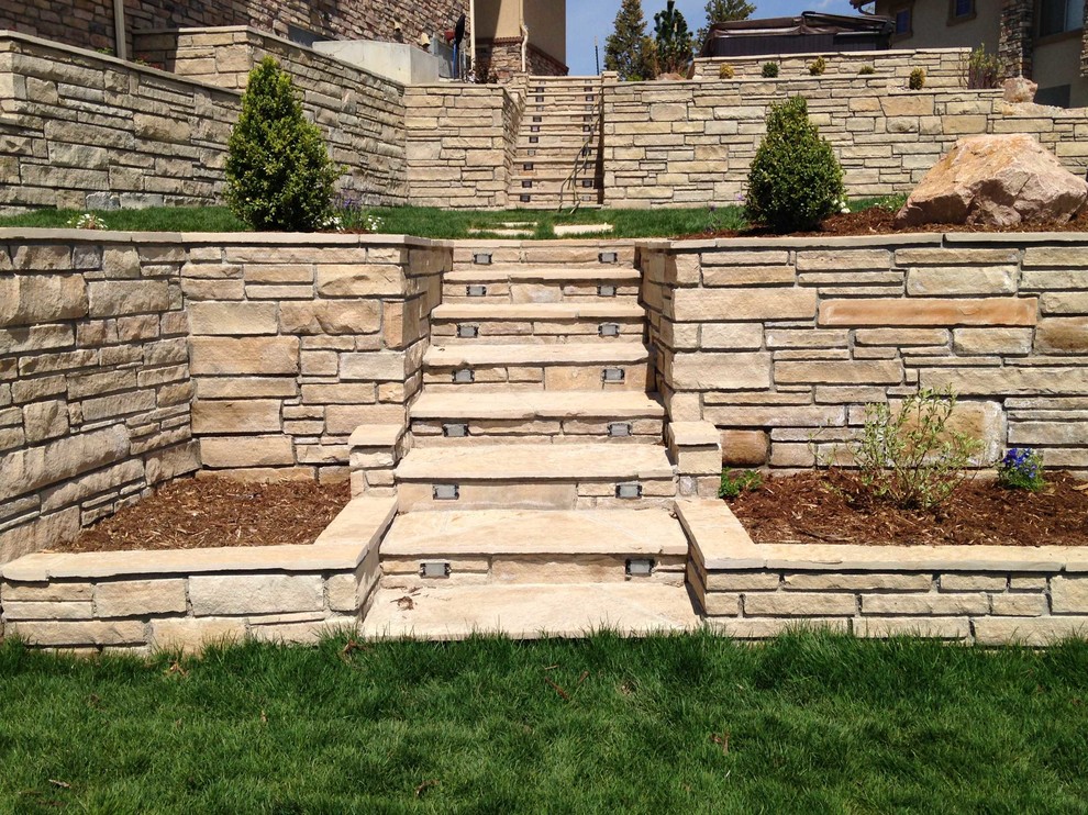 Inspiration for a large contemporary side garden in Denver with a pathway and natural stone paving.