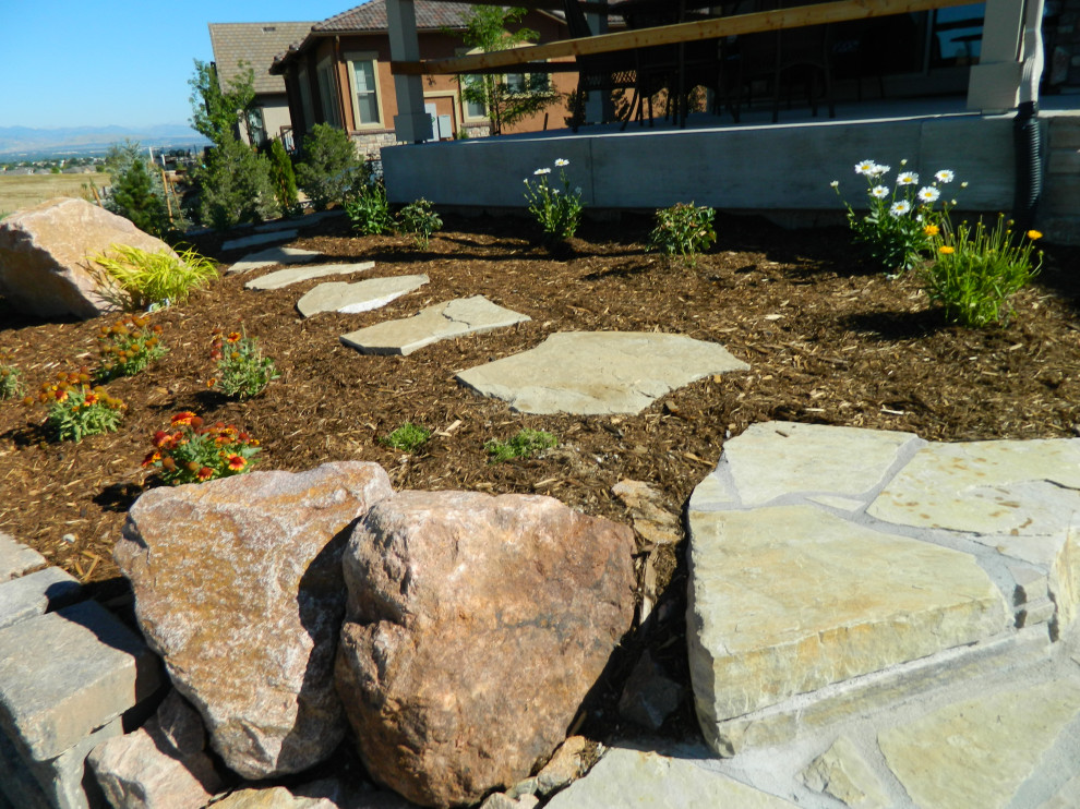 Medium sized contemporary back garden in Denver with a pathway and natural stone paving.