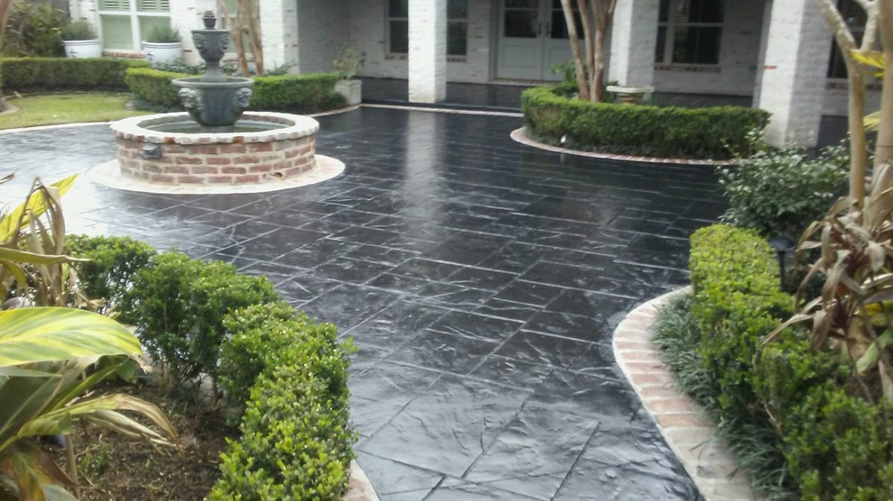 Design ideas for a mid-sized contemporary front yard concrete paver landscaping in Houston.
