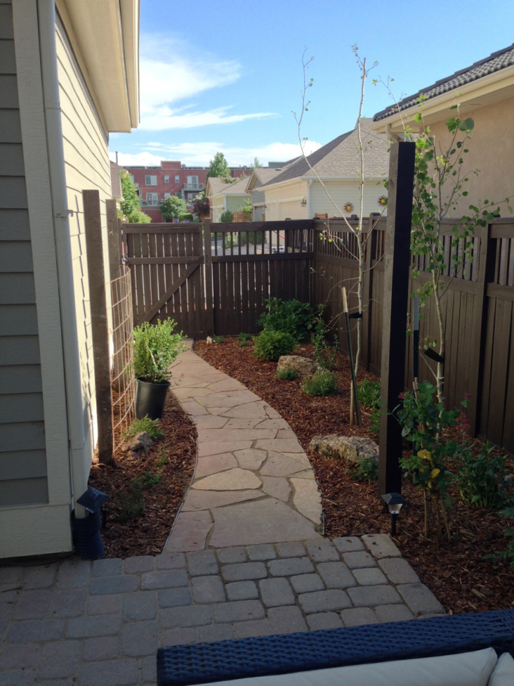 Photo of a small drought-tolerant and full sun side yard stone garden path in Denver.