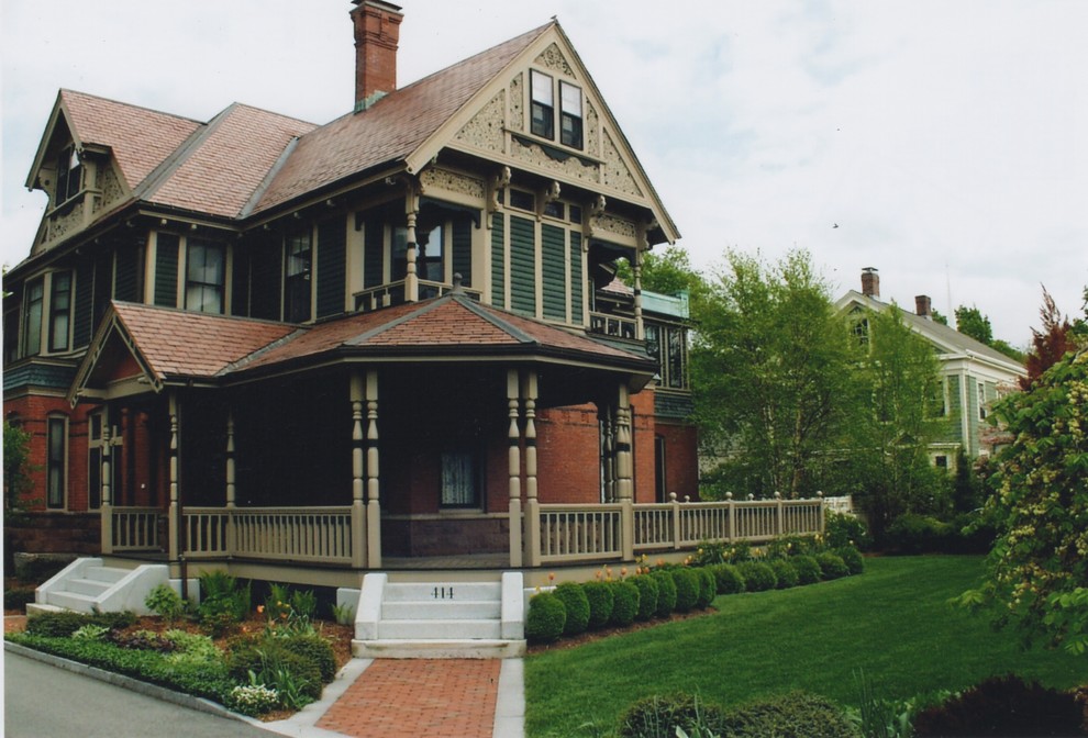 Inspiration for a mid-sized victorian full sun front yard brick formal garden in Boston.