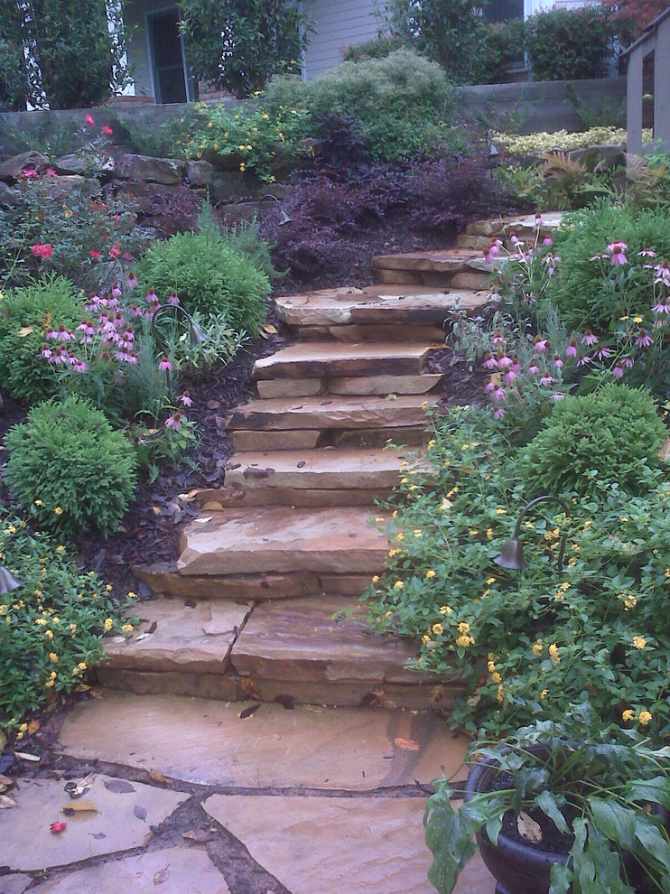 Design ideas for a large contemporary backyard stone landscaping in Atlanta.