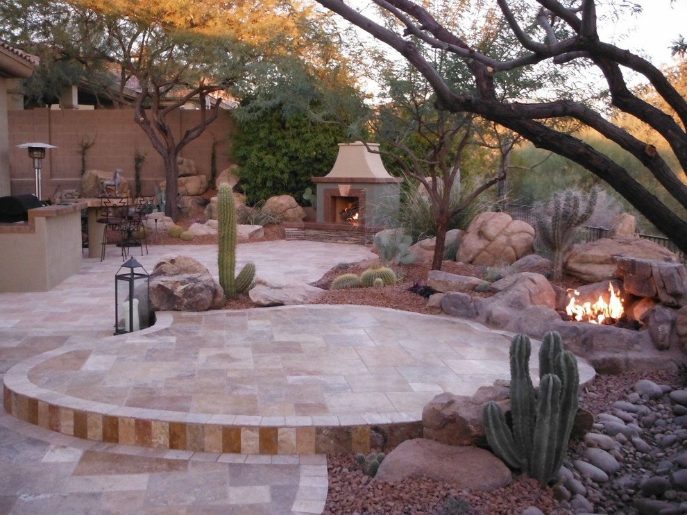 Design ideas for a huge southwestern backyard landscaping in Phoenix with a fire pit.