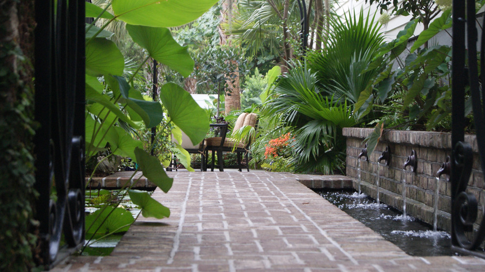 Design ideas for a small traditional partial sun courtyard brick landscaping in Charleston.