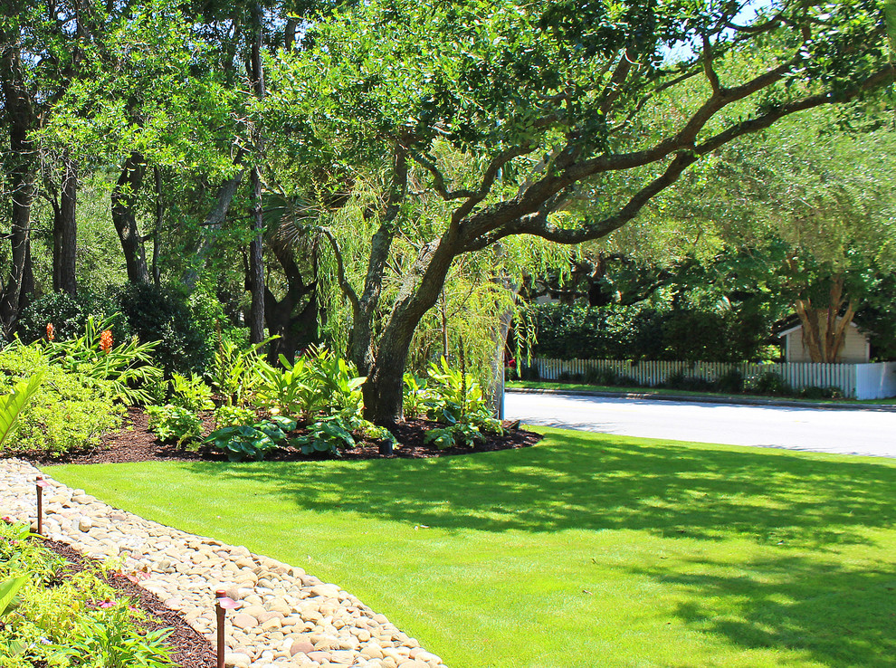 Photo of a coastal partial sun front yard landscaping in Charleston.