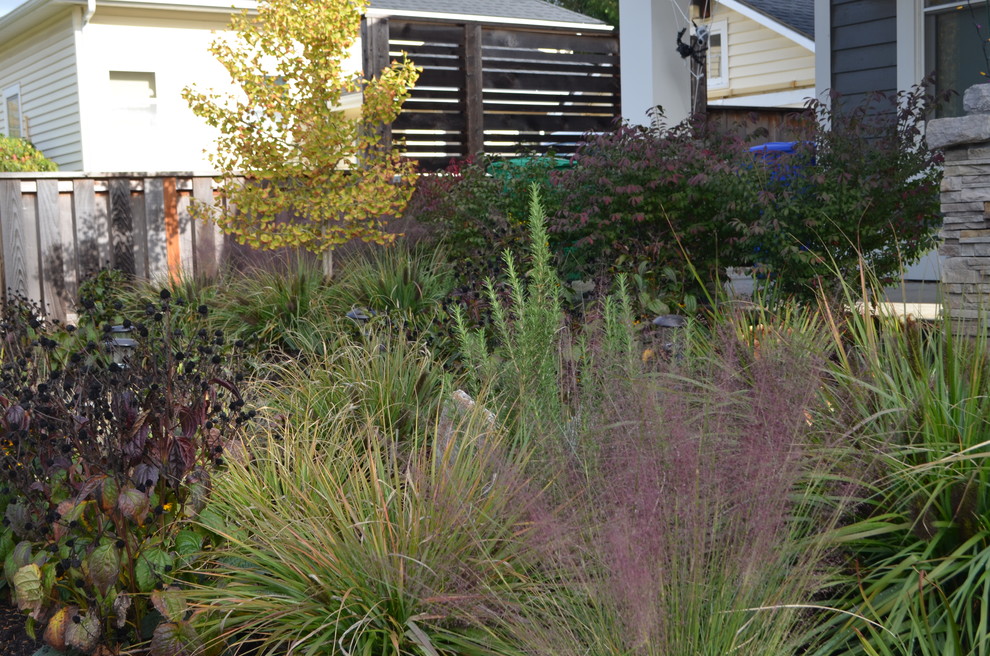 Inspiration for a small modern front xeriscape full sun garden in Portland with a garden path and natural stone paving.