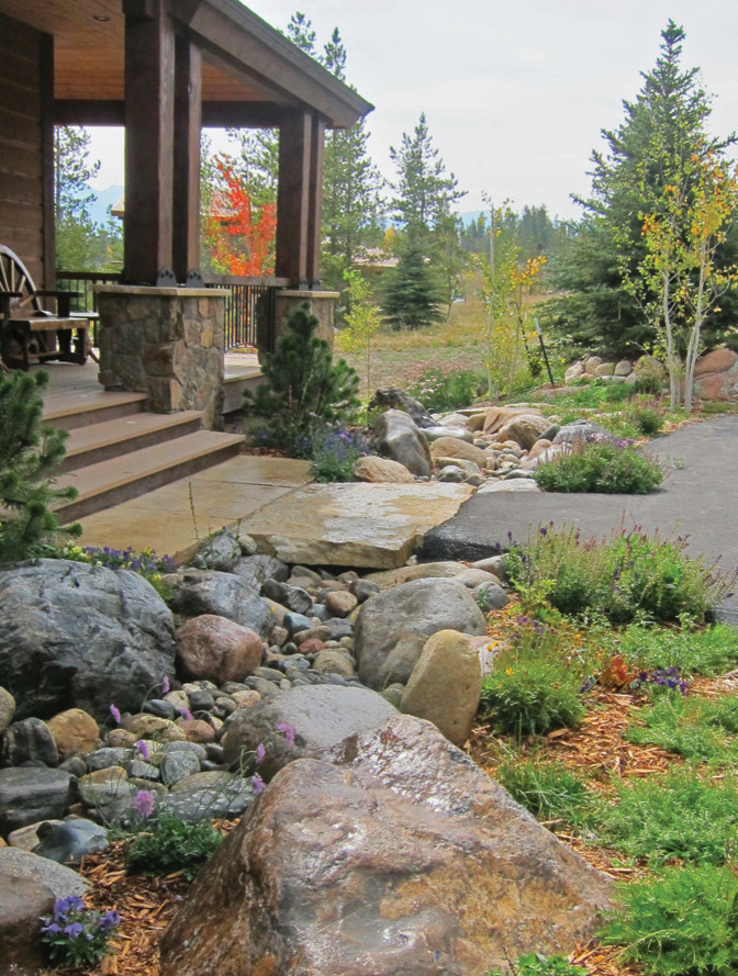 Medium sized rustic front xeriscape partial sun garden for autumn in Denver with a pathway and decking.