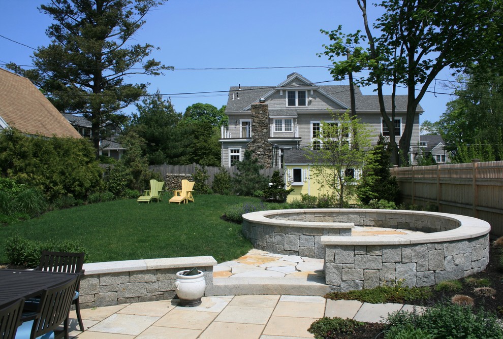 Inspiration for a small coastal full sun backyard stone landscaping in Boston.