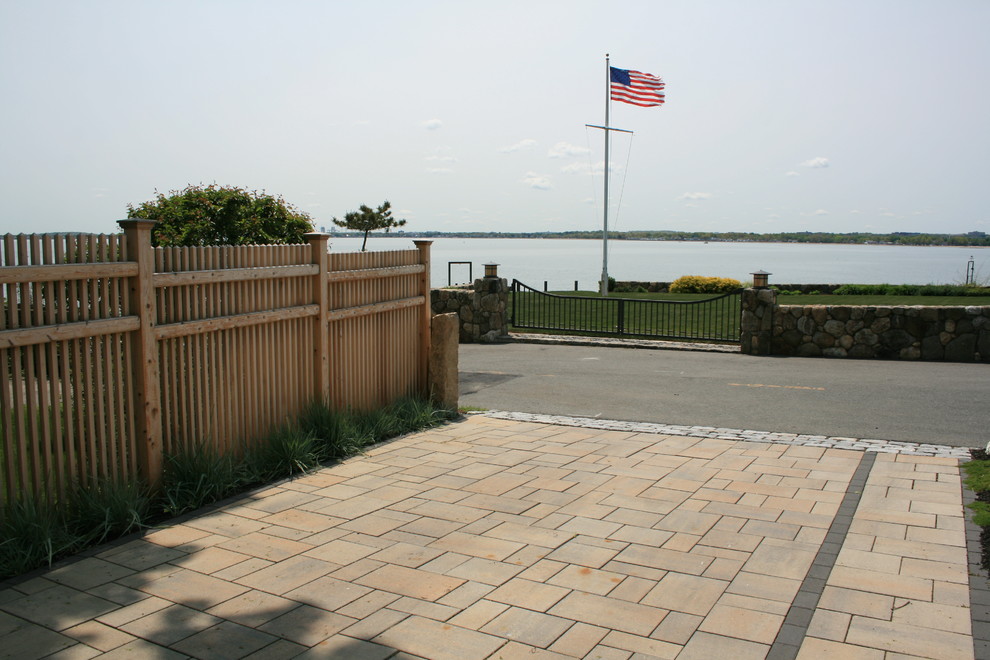 Design ideas for a small coastal full sun front yard concrete paver driveway in Boston.