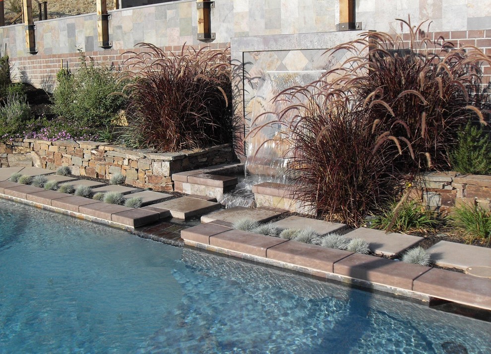 Design ideas for a large modern partial sun backyard concrete paver water fountain landscape in San Francisco.