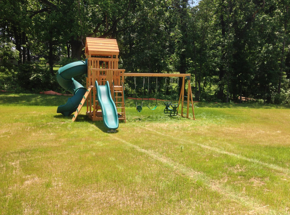 This is an example of a medium sized garden in Philadelphia with a climbing frame.