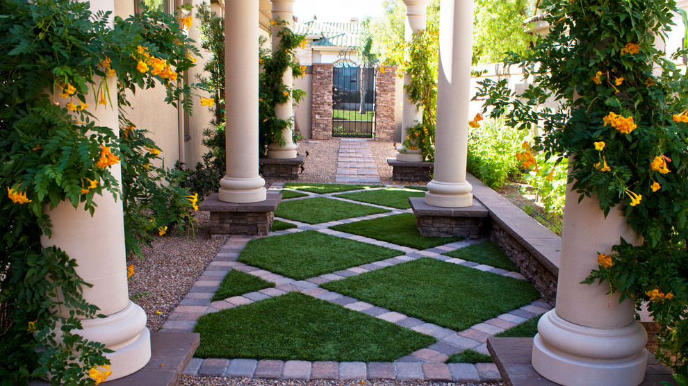 Design ideas for a large mediterranean drought-tolerant and partial sun side yard concrete paver landscaping in Las Vegas.
